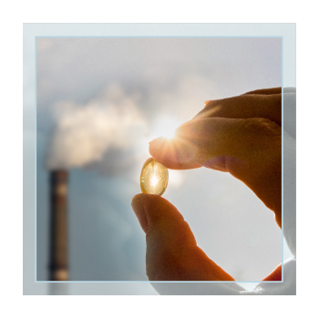 Capsul with smokestack in the background