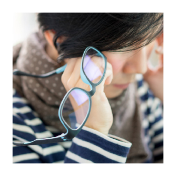 Person holding their temple