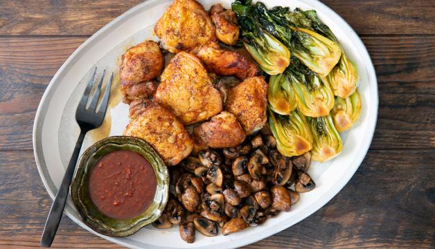 Natural Grocers Sweet and Spicy Korean Roasted Chicken Thighs Served with Mushrooms and Bok Choy